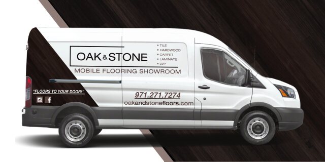 Image presents the Oak & Stone Floors mobile van that brings their flooring showroom to your front door.