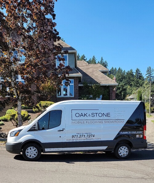 Image presents the Oak & Stone Floors Shop-At-Home mobile van in route bringing their flooring showroom to your front door.